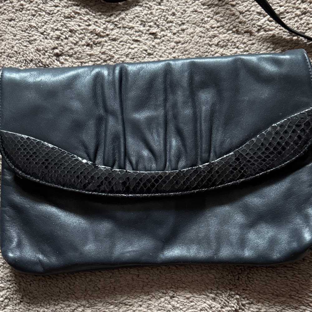 Elegant Black Leather Clutch with Snakeskin Border on Flap